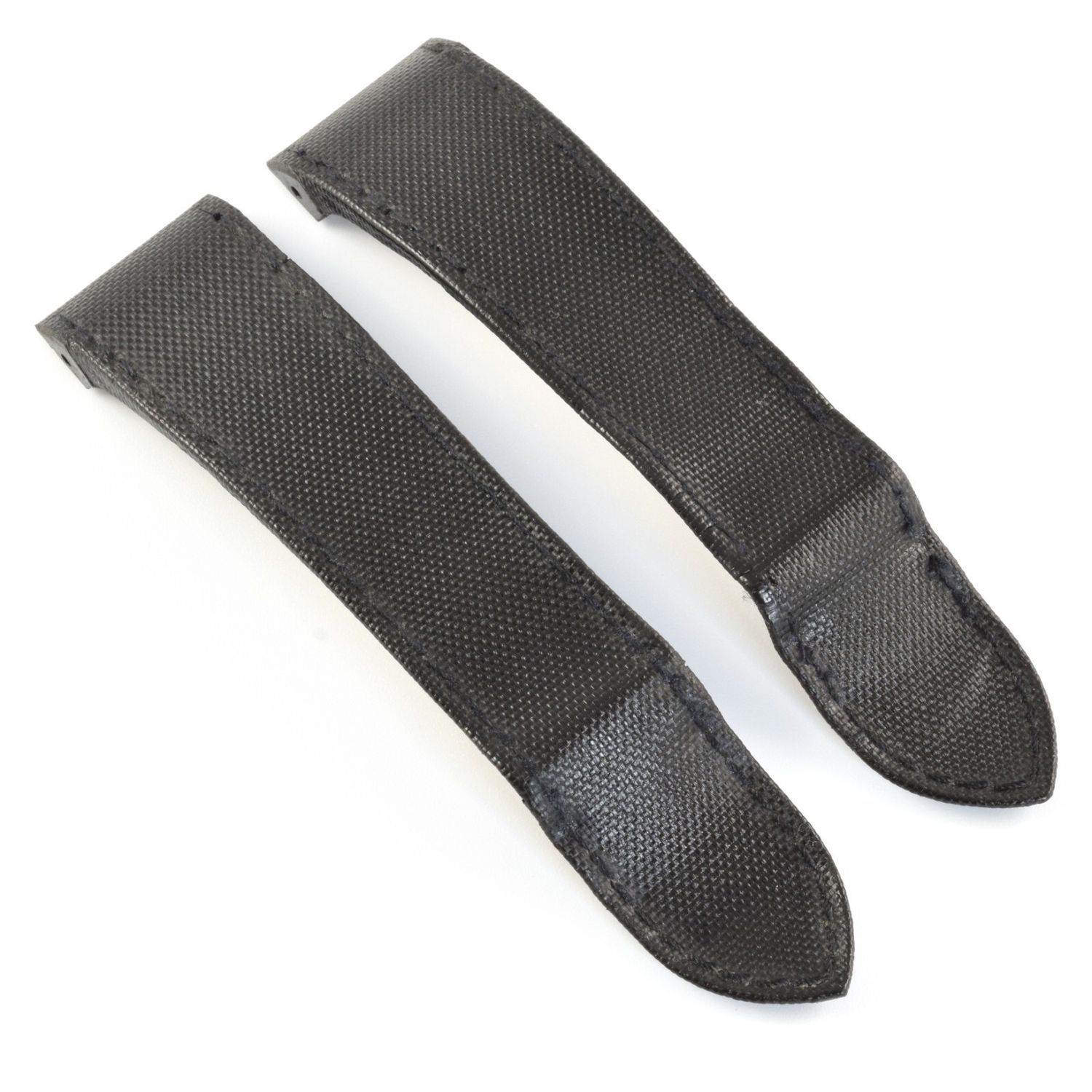 Authentic Cartier Santos 100 XL watch strap made from black canvas with black calf leather underside, shown as two separate pieces angled side by side