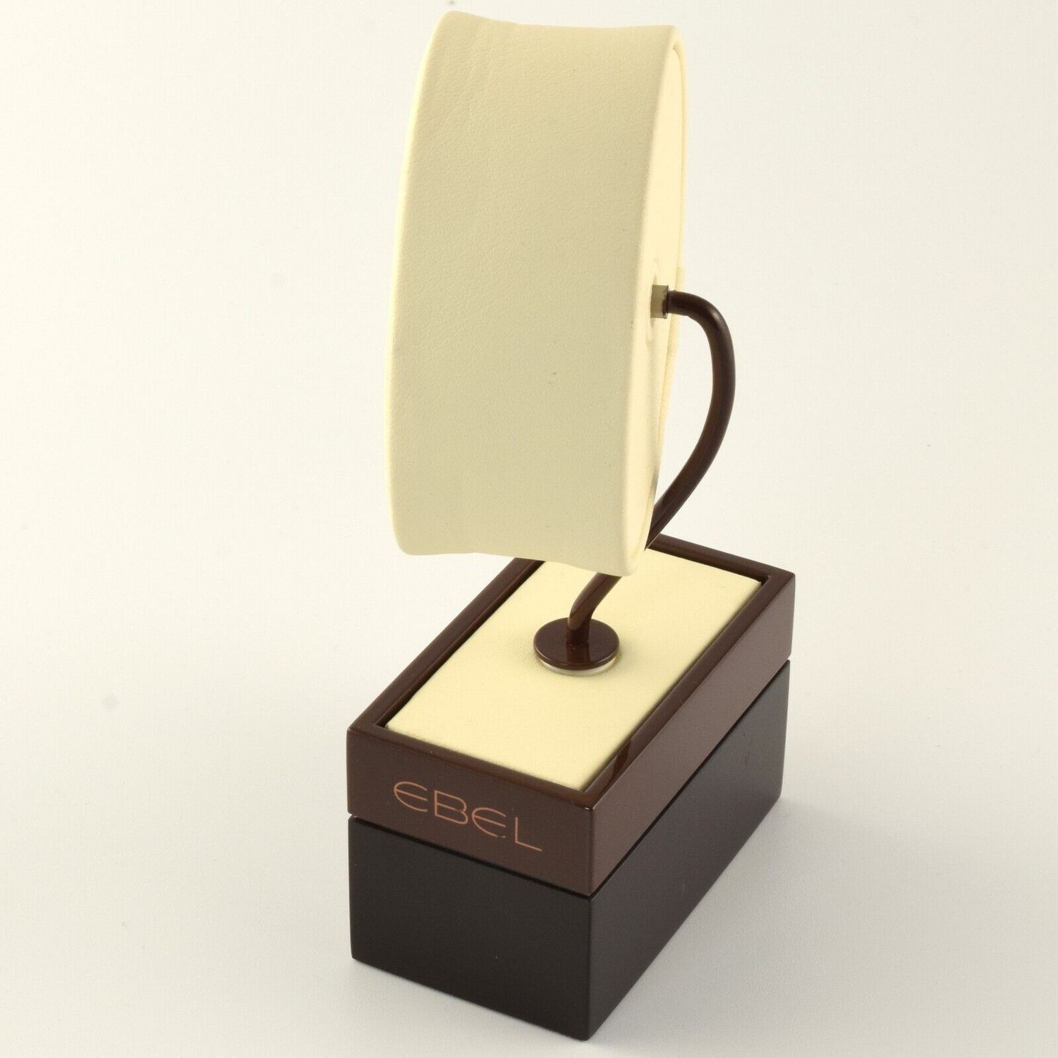 New authentic EBEL watch display stand with cream leather oval pillow mounted on a curved brown arm and brown base with EBEL logo printed on the front