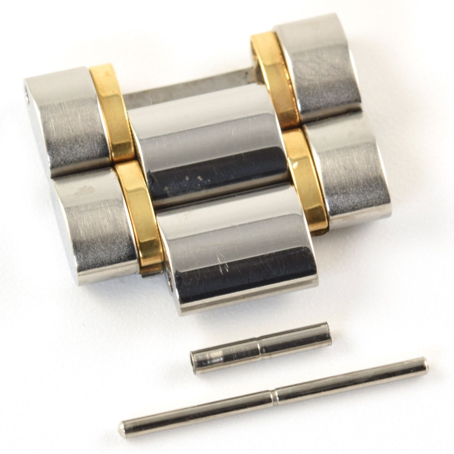 Omega gold and steel double watch link with pin and tube for 1469 1479 1489 bracelets on white background