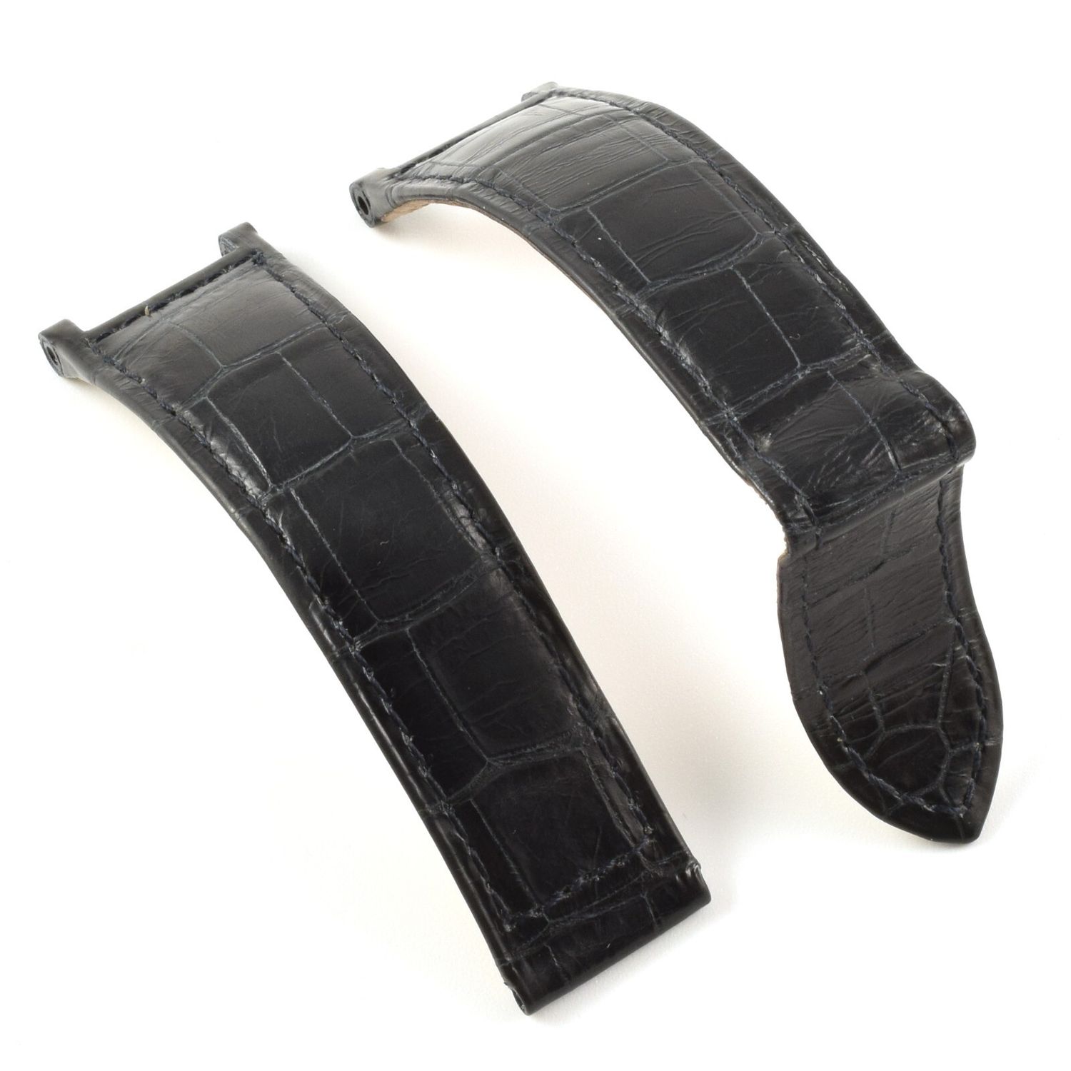Black Cartier Pasha alligator leather watch strap with curved ends, pointed tip, and visible stitching on both pieces