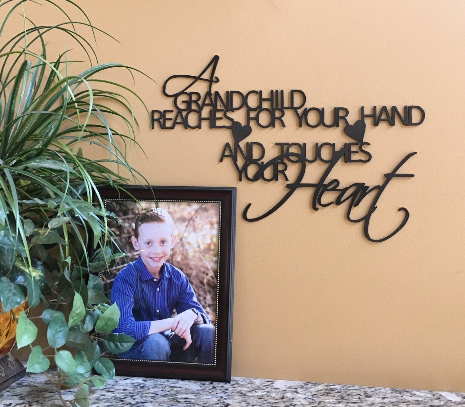 A Grandchild reaches for your hand and touches your Heart