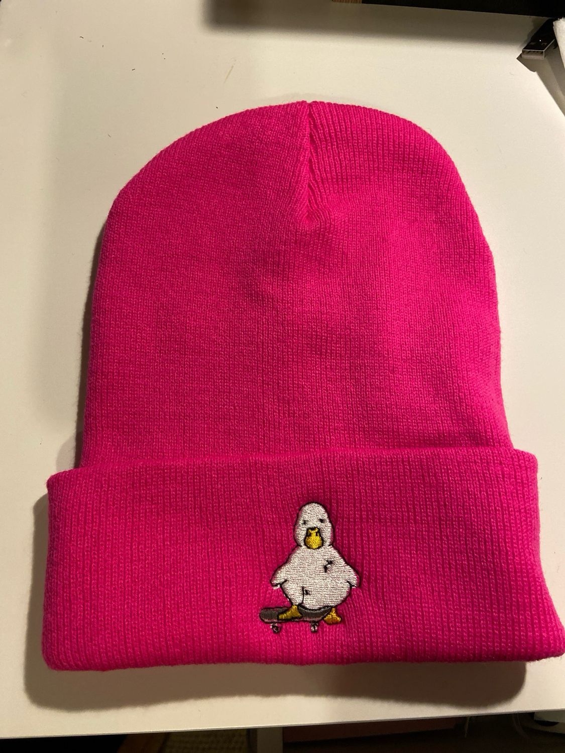 Headwear - Pink Knitted Hat With Embroidered Duck.