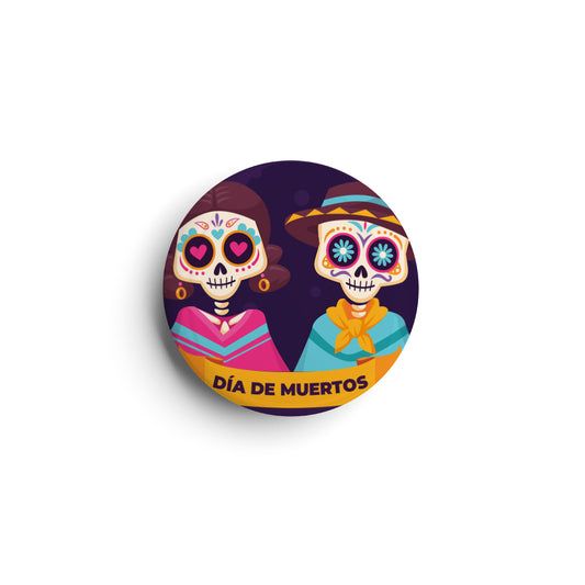 Circular badge/sticker/magnet with two cartoon characters.