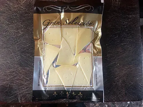 Queso manchego oveja D.O 100 gr cortado a cuchillo a triángulos