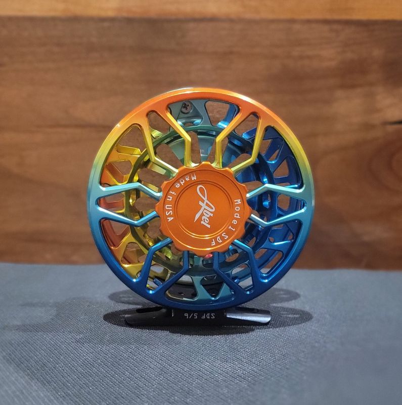 Abel SDF 5/6 Reel - Ported - Baja Fade - Orange Drag Knob - Red Aluminum Handle Abel SDF 5/6 Reel - Ported - Baja Fade - Orange Drag Knob - Red Aluminum Handle