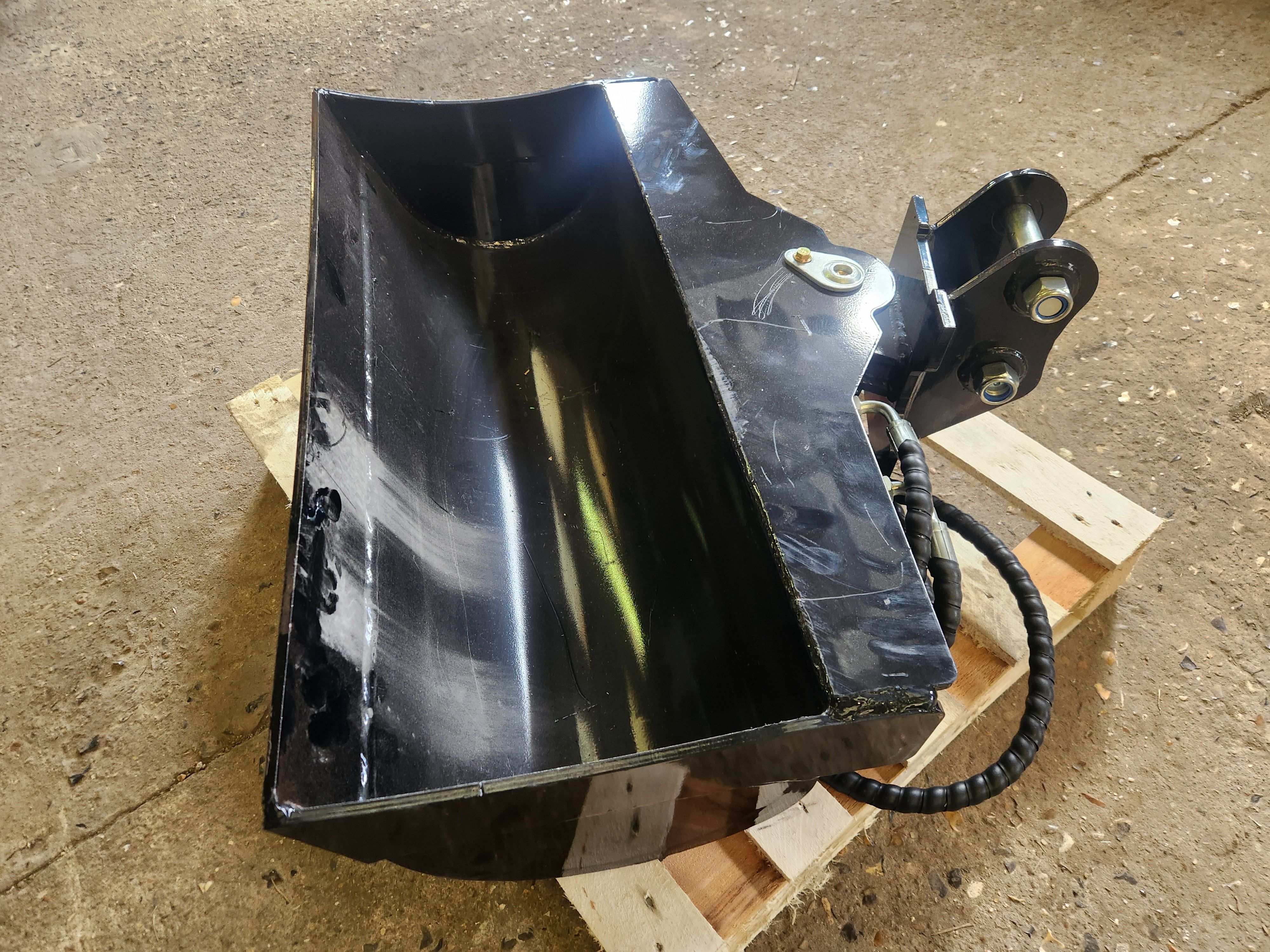 Godet de curage orientable