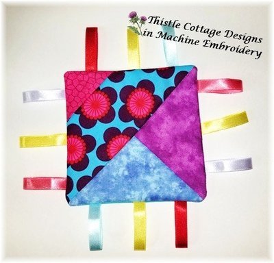 Stitch N&#39; Flip Quilted Taggie Block 1 Soft Toy