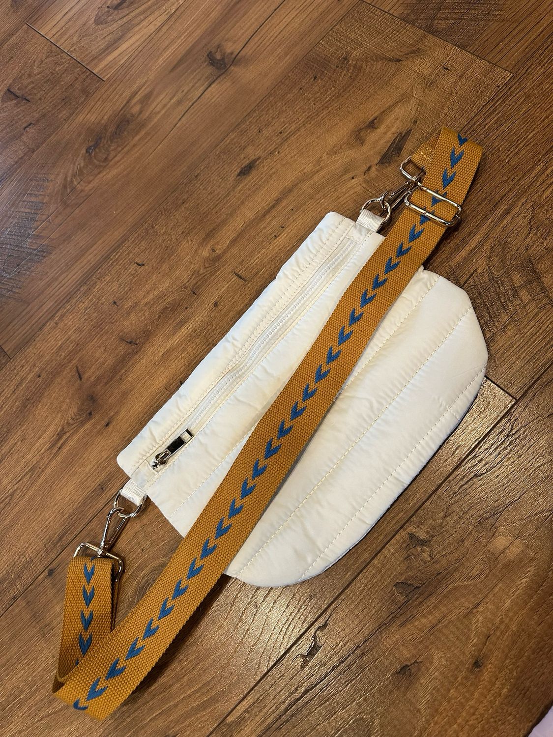 Cream w/ b/y arrow strap puffer