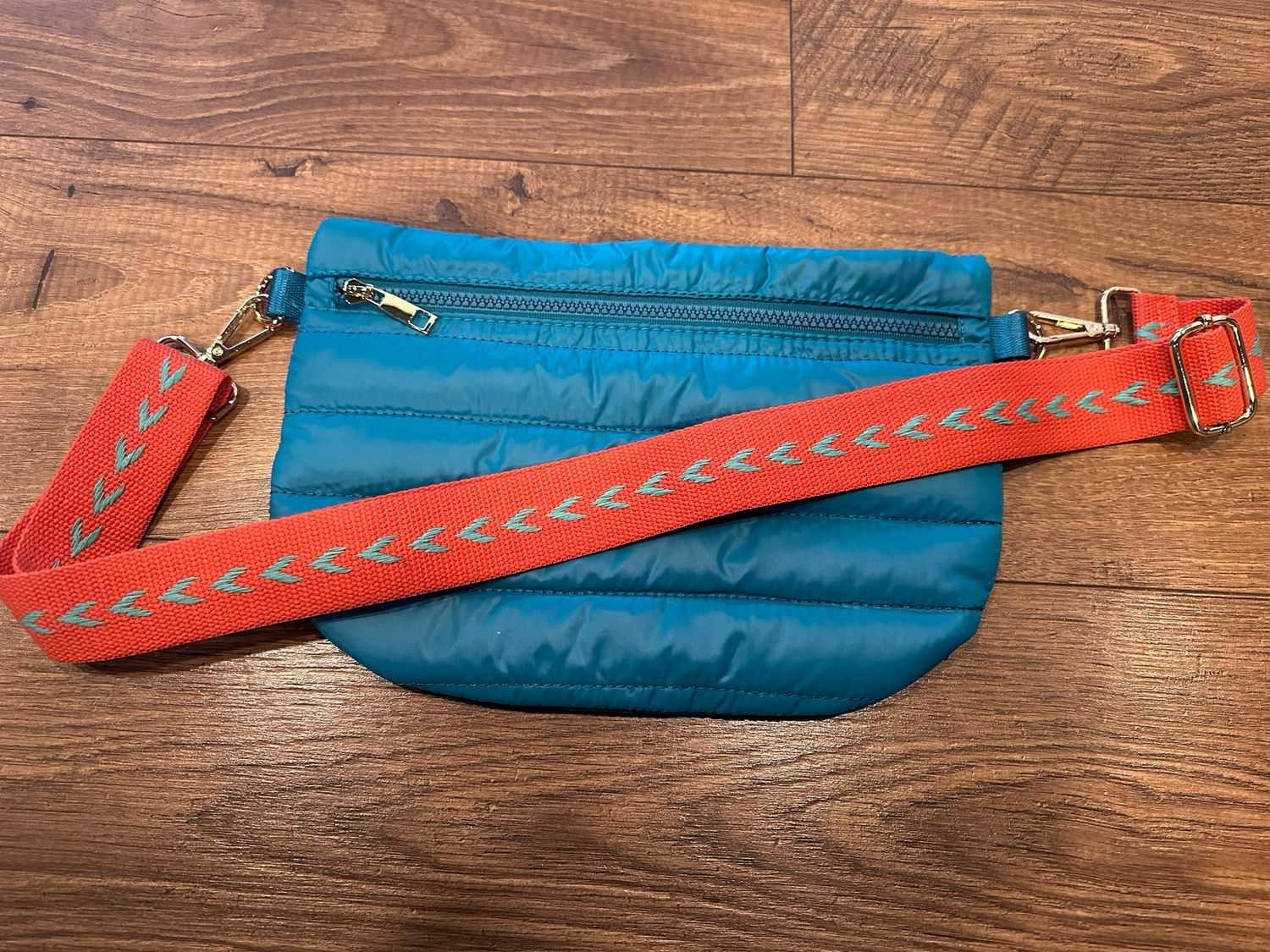 Teal w/ pink/teal arrow strap puffer