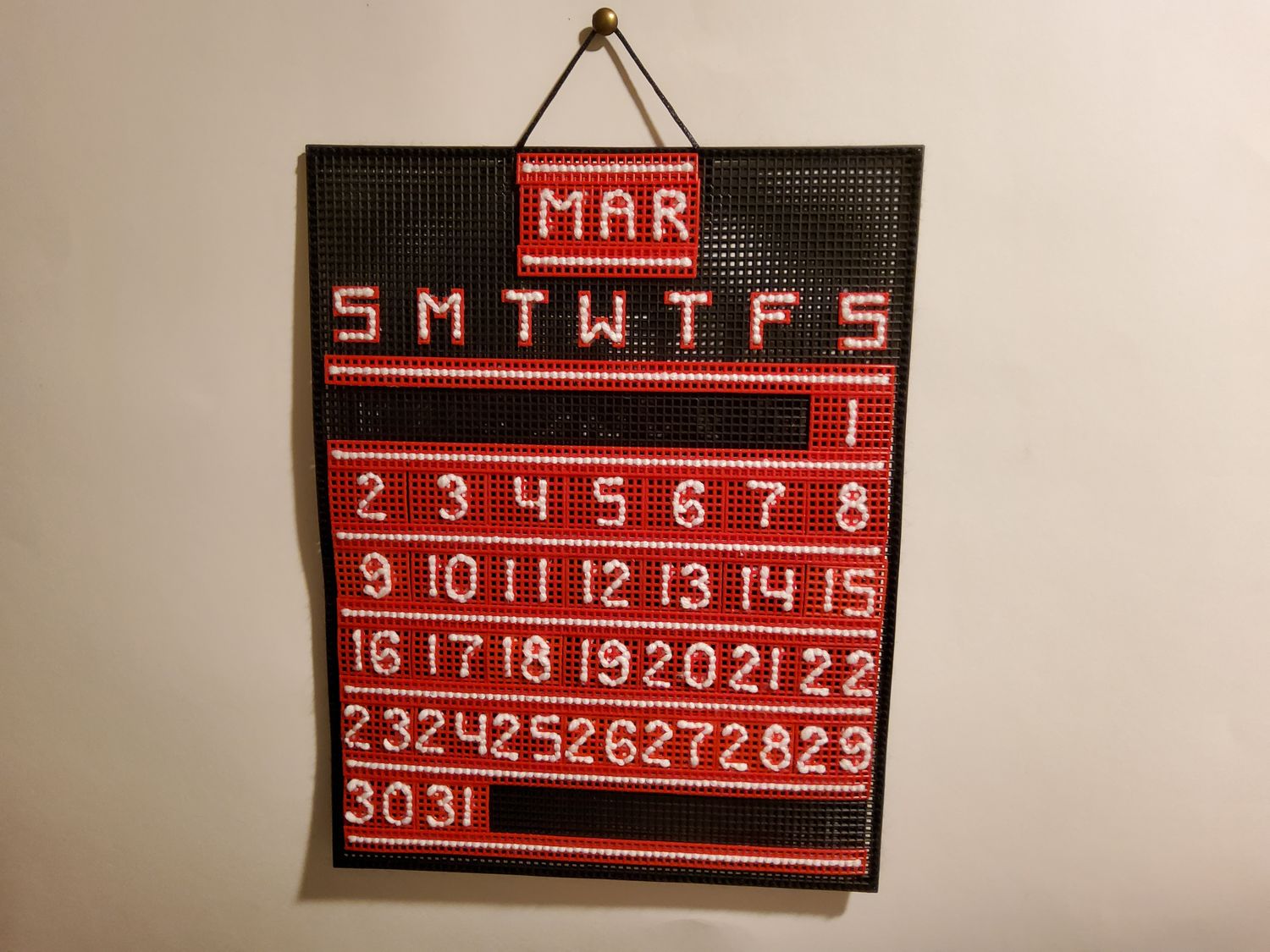 Custom Craft Calendar Primary: Black, Red. Secondary: White.
