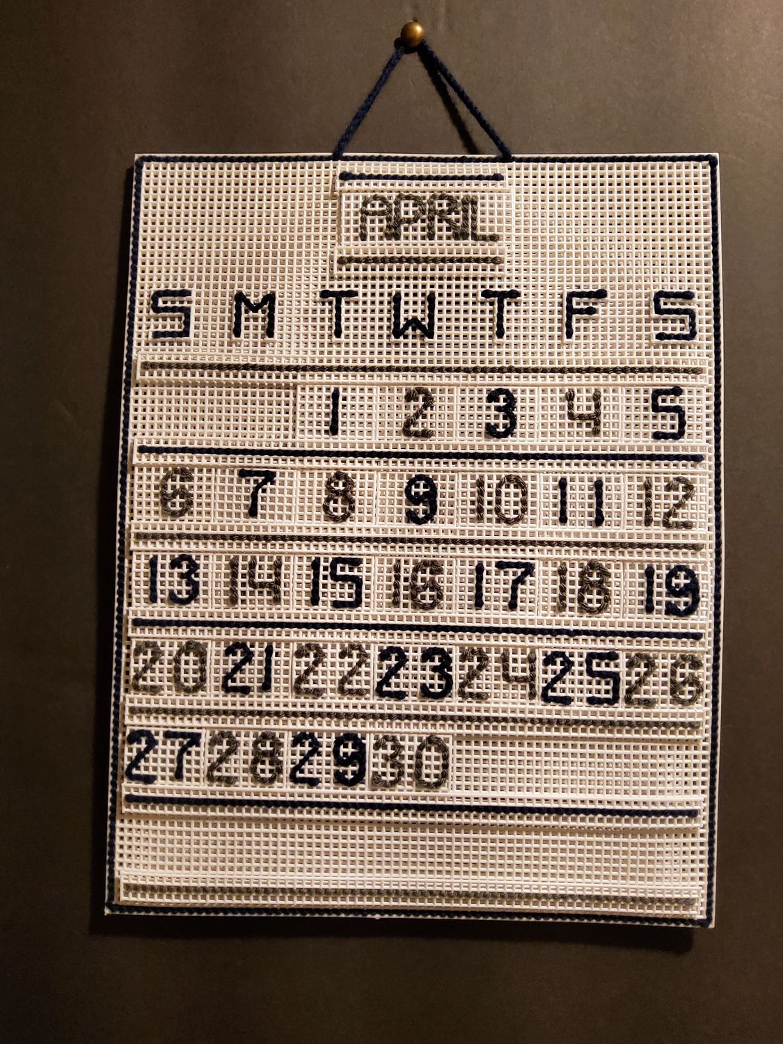 Custom Craft Calendar Primary: White. Secondary: Navy Blue, Gray