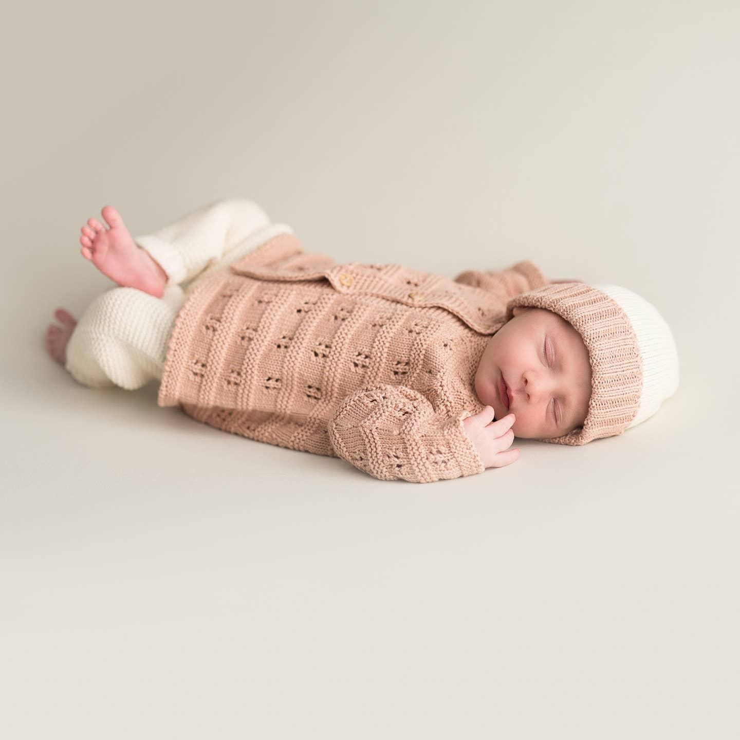 Veste rose ajourée