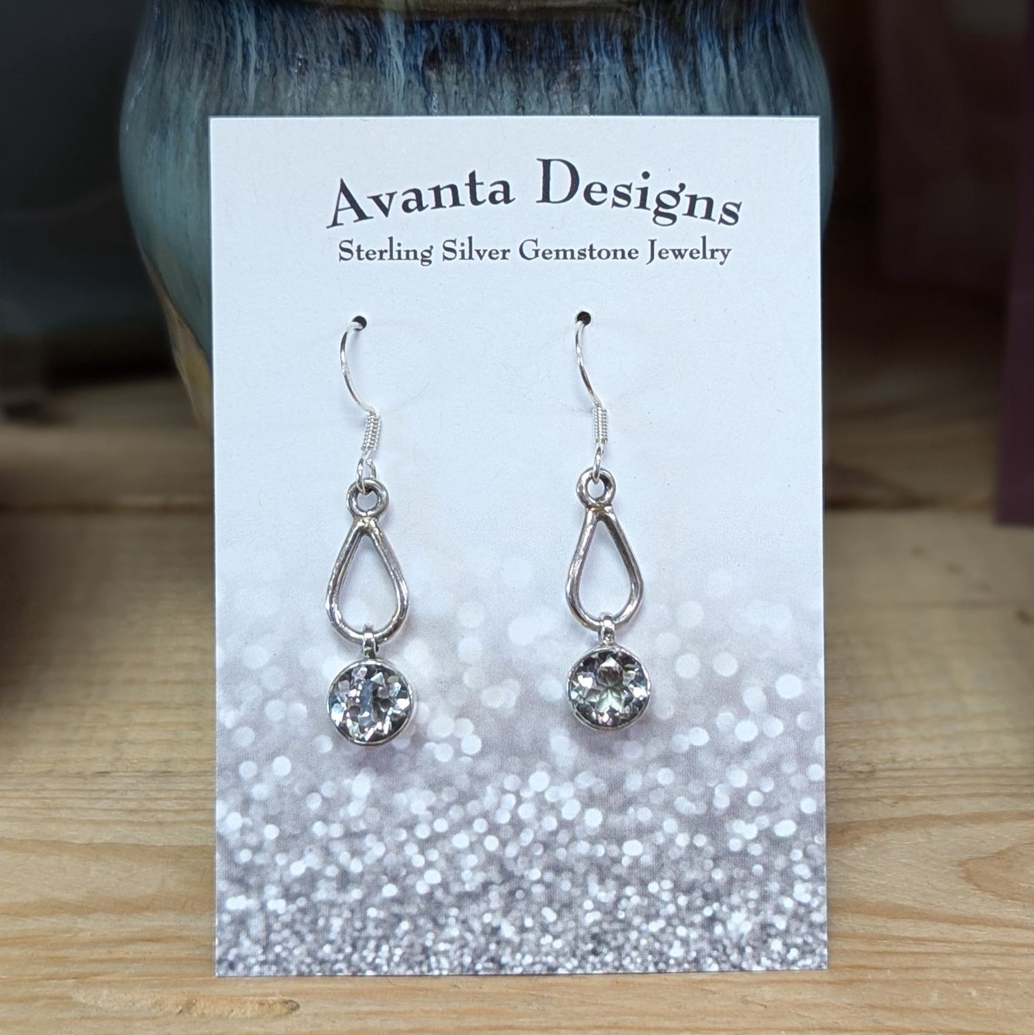 Sterling Silver Faceted Blue Topaz and Teardrop Cut Out Earrings