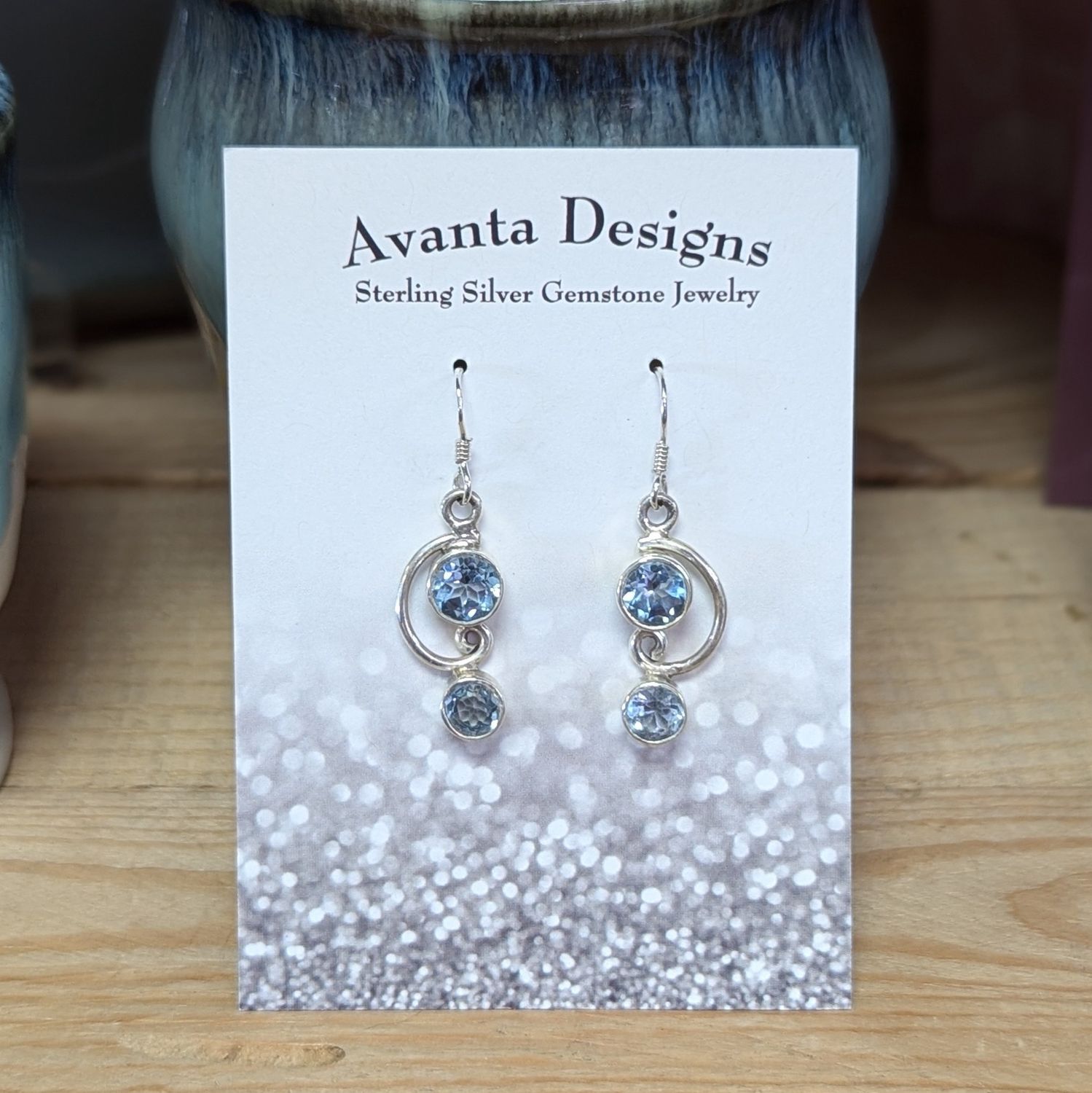 Sterling Silver Facted Blue Topaz Swirl Earrings
