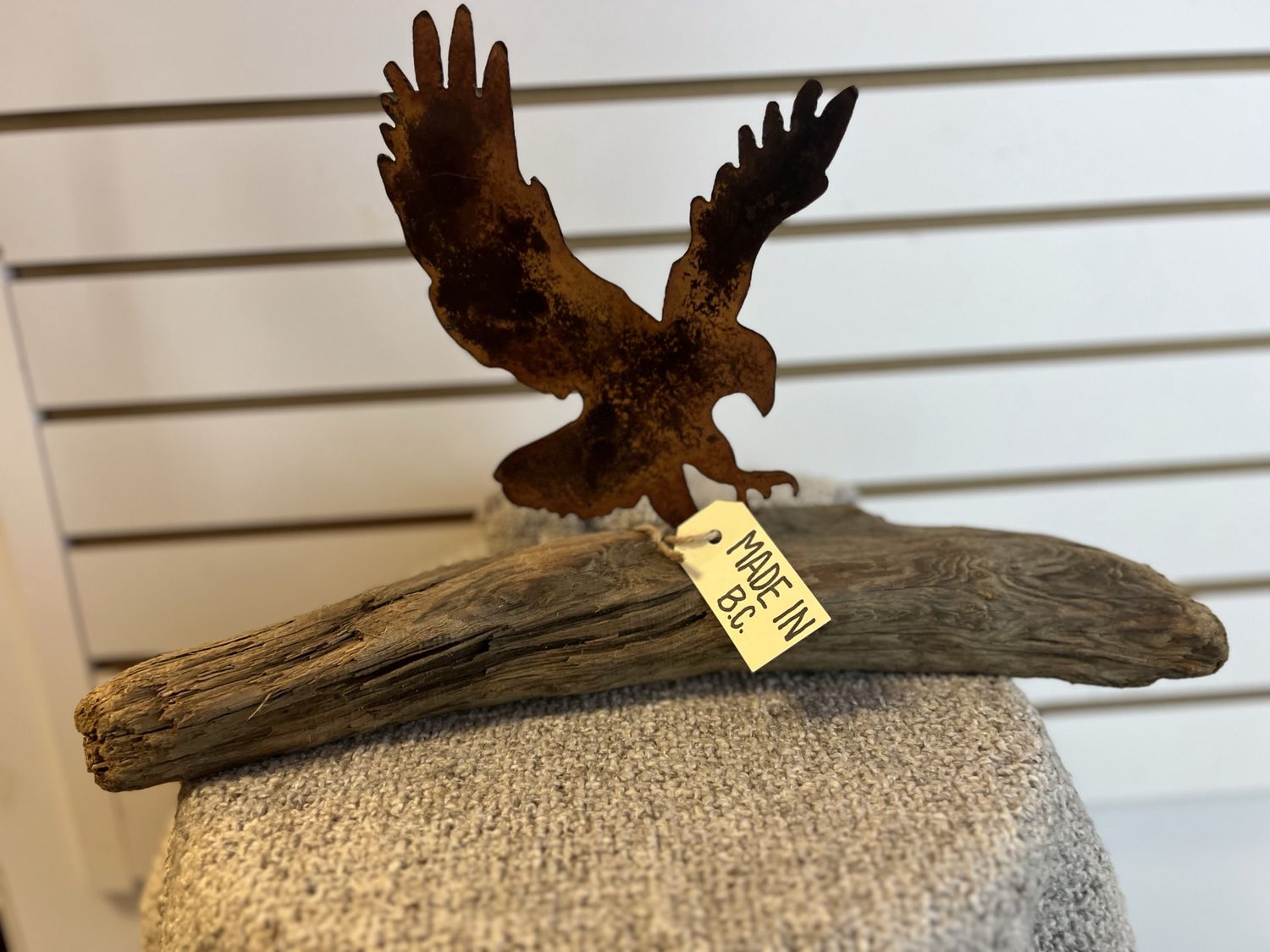 Rusted Metal Eagle on Driftwood