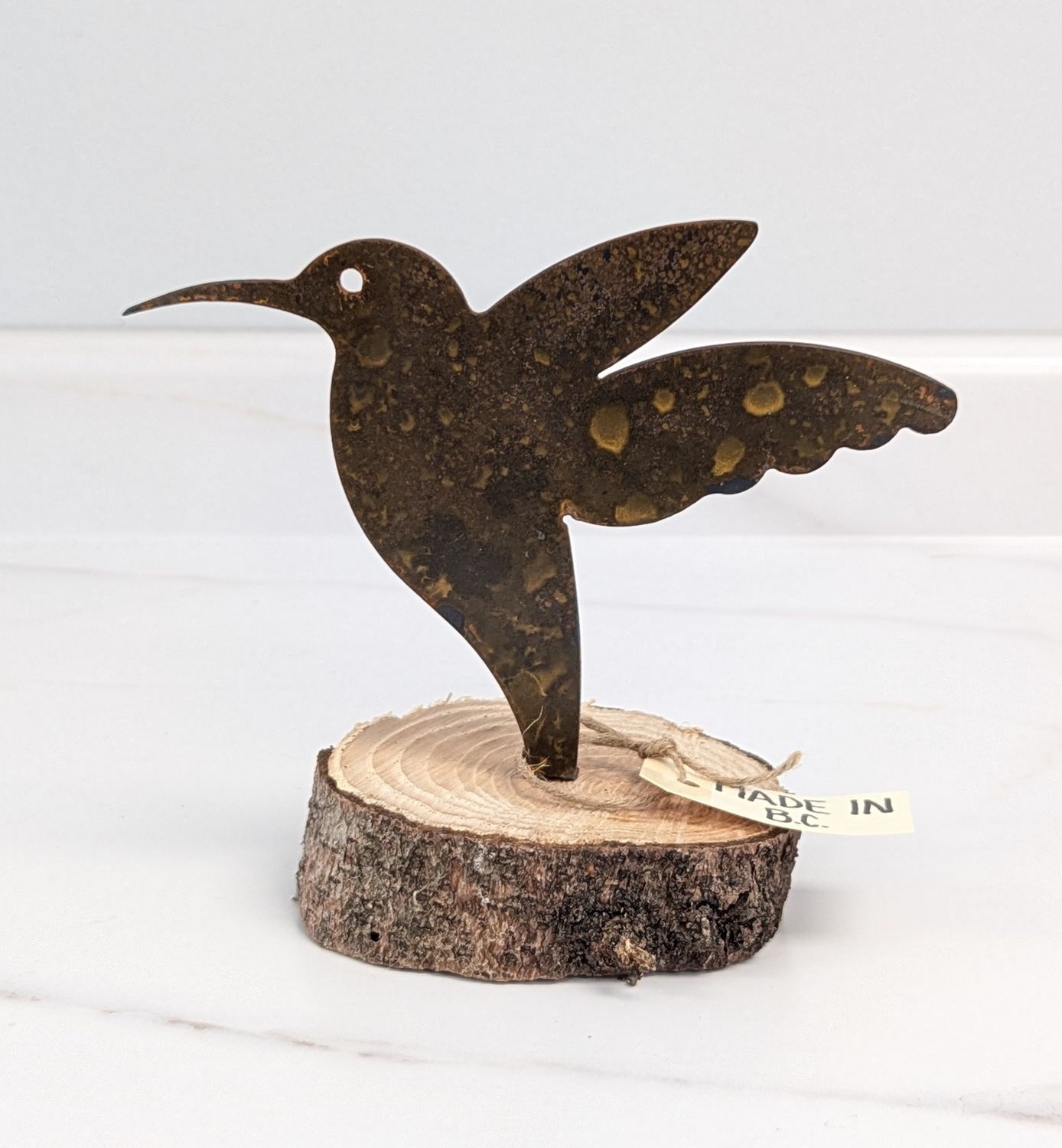 Rusted Hummingbird on Log