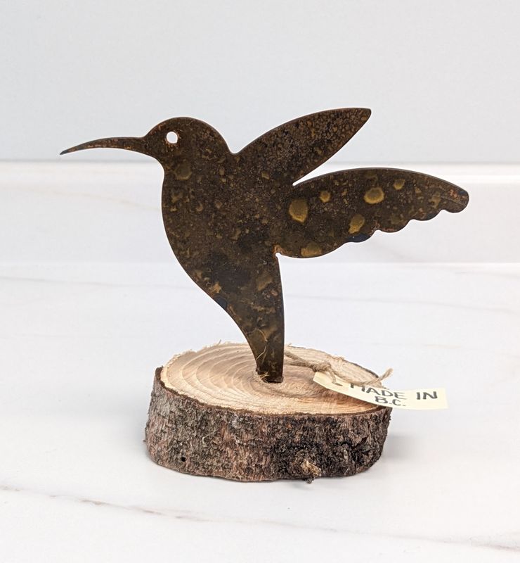 Rusted Hummingbird on Log