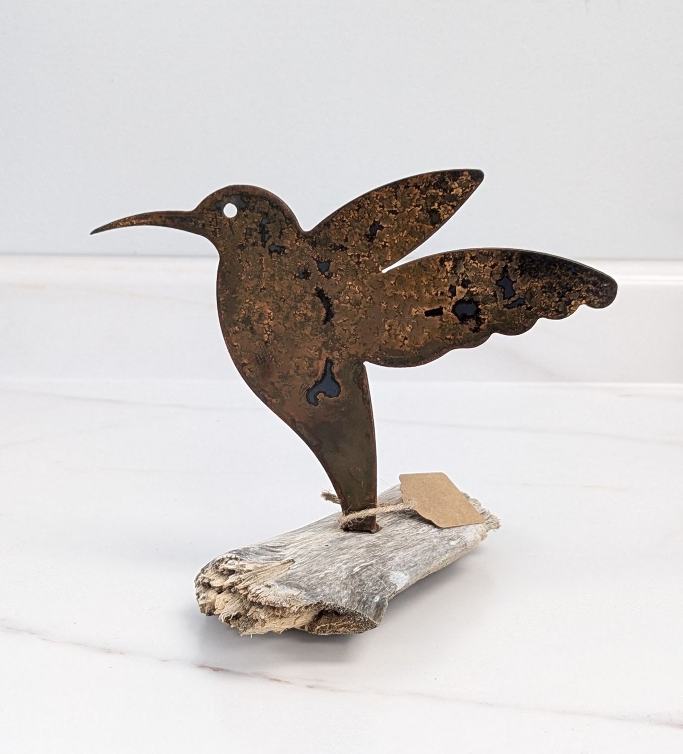 Rusted Hummingbird on Driftwood