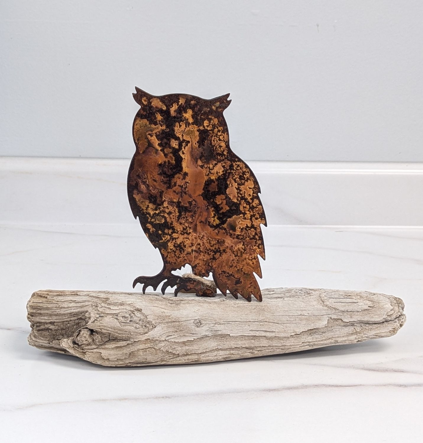 Rusted Metal Owl on Driftwood