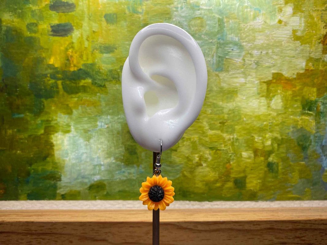 Arete girasol