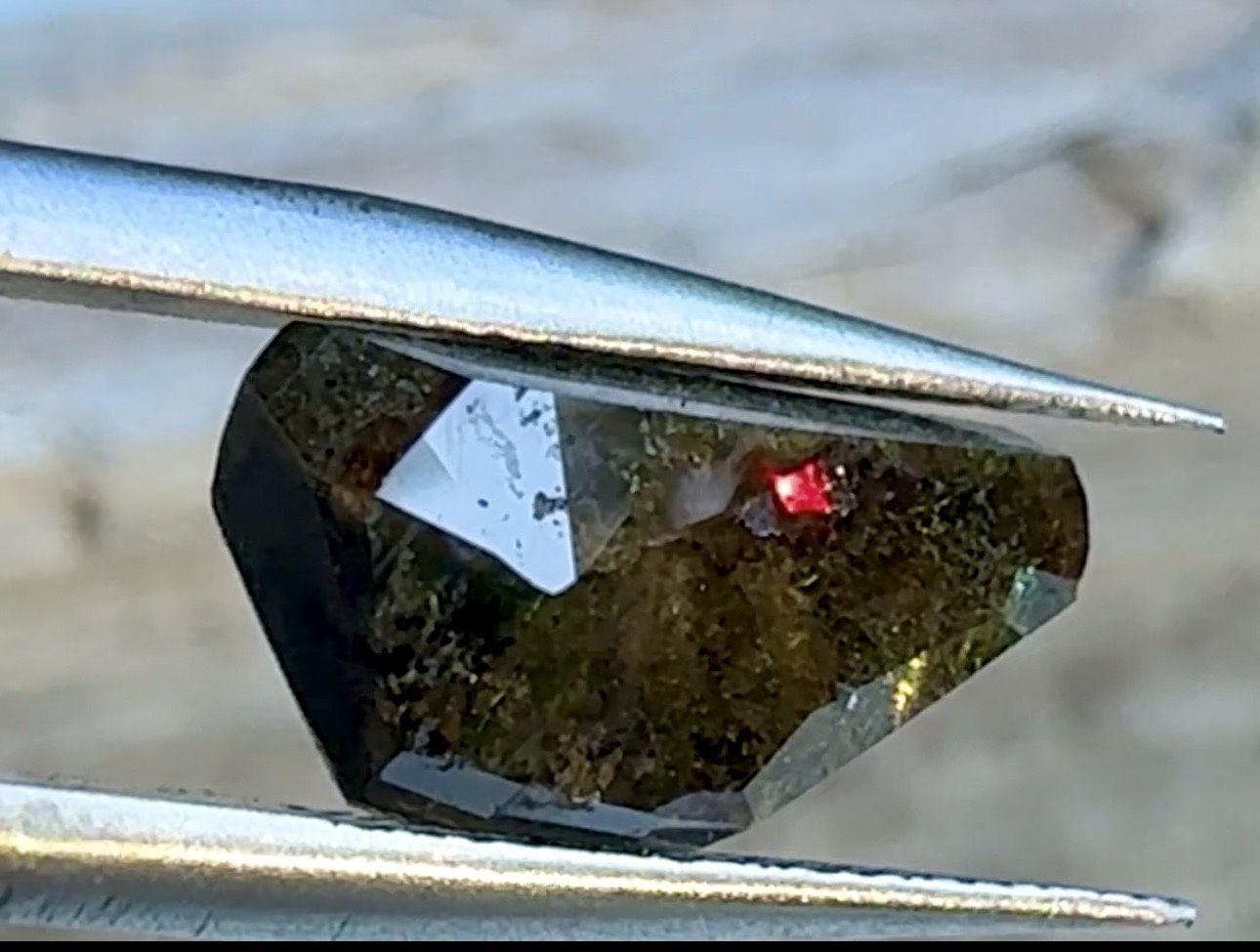 “Eye of Kukulkan” – Serpent Head Rainbow Garnet  Faceted Iridescent Andradite Garnet | Rainbow Mine, Nevada 4.45 cts | 13.15 mm x 6.8 mm x 4.28 mm