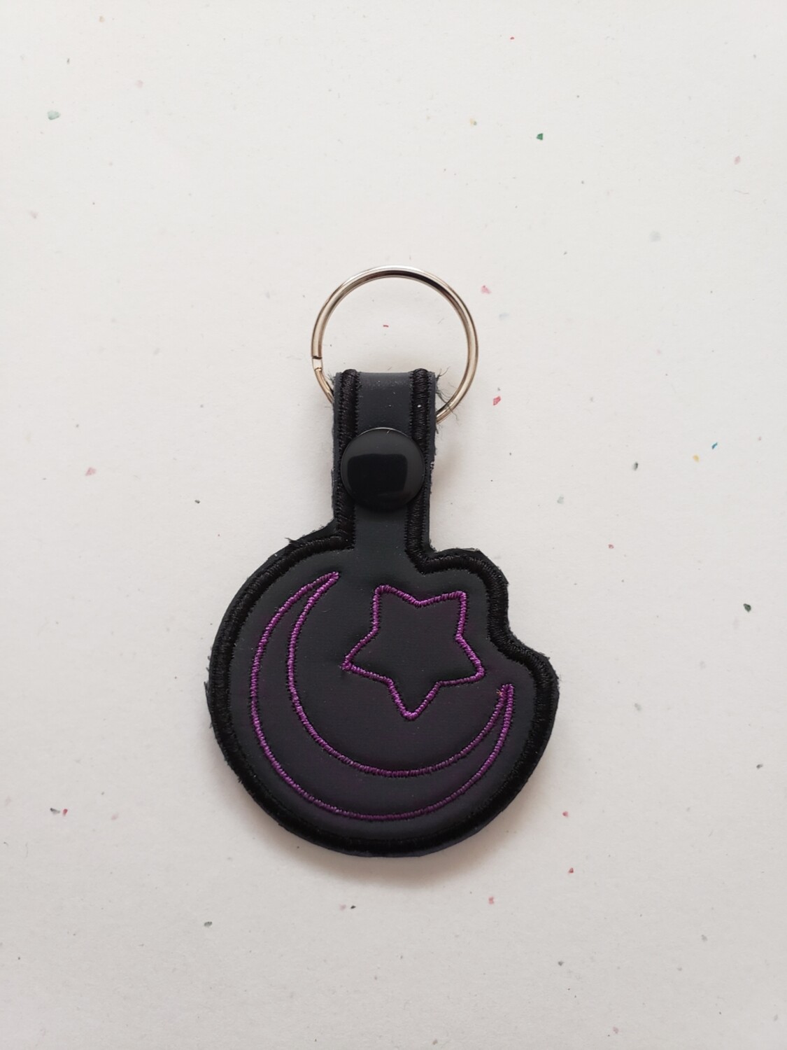 Star and moon keychain in rainbow reflective fabric in magenta rts