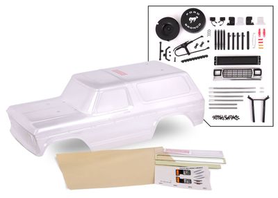 Traxxas Body, Ford Bronco (1979), complete (clear, trimmed, requires painting) (includes grille, side mirrors, door handles, windshield wipers, spare tire mount, decals, window masks) (requires #8072 