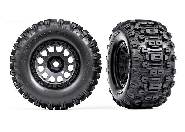 Traxxas Tires &amp; wheels, assembled, glued (XRTÔøΩ Race black wheels, SledgehammerÔøΩ tires, foam inserts) (left &amp; right)