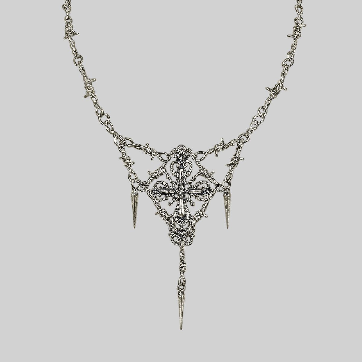 Collar de púas y cruz