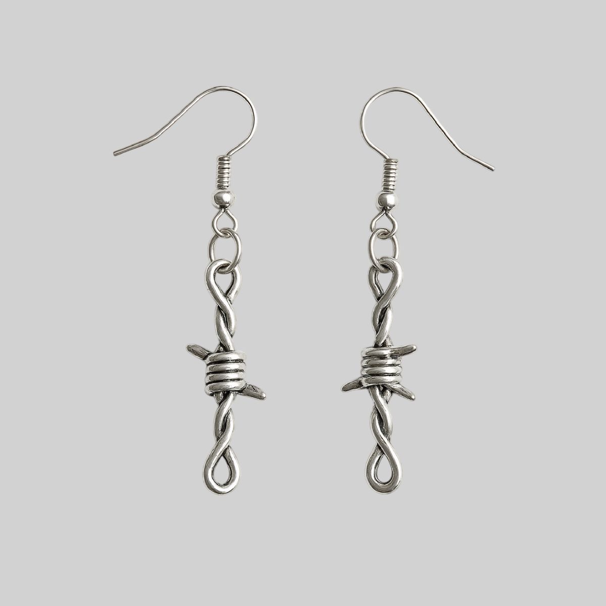 Aretes de púas metálicas