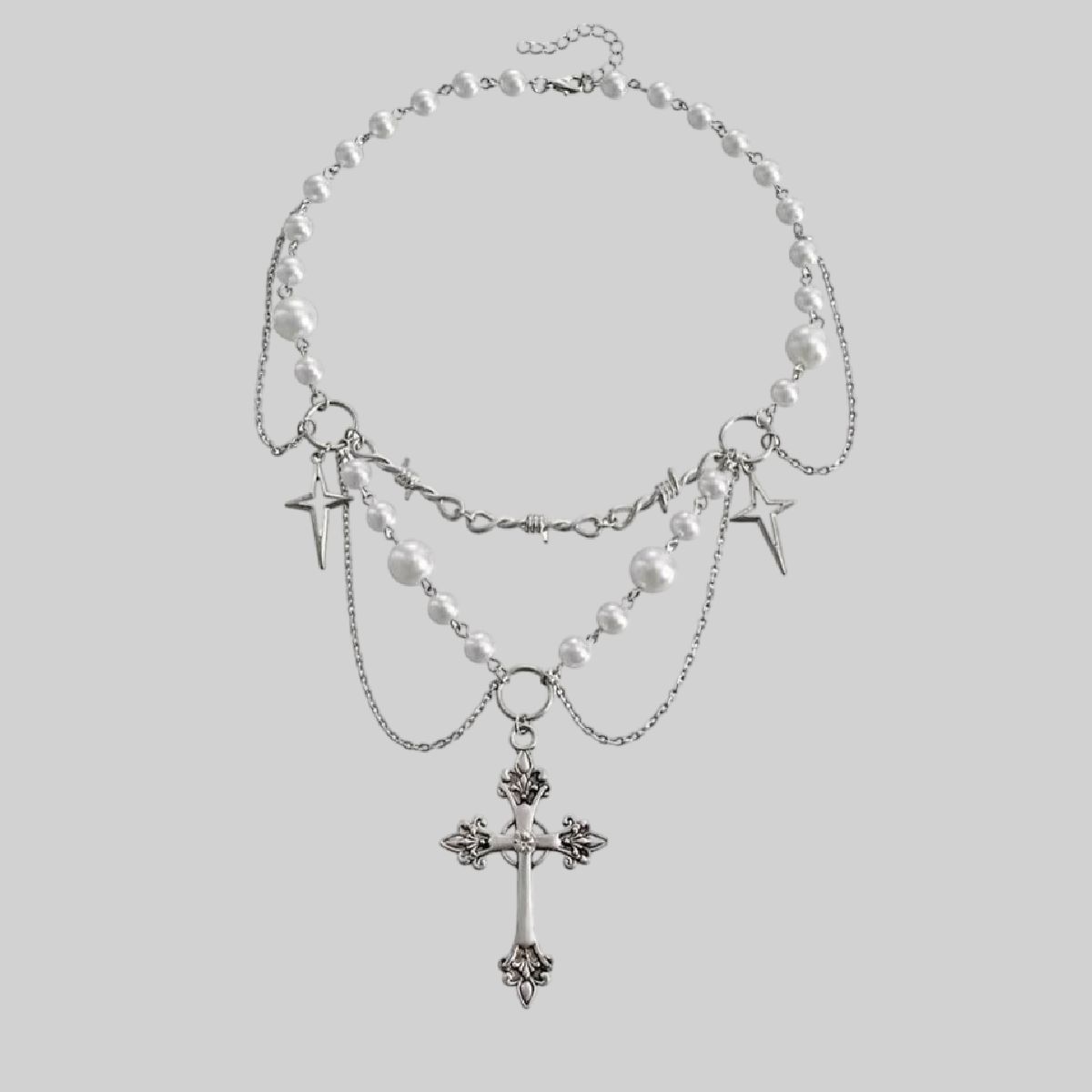 Collar de capas con dijes de estrella y cruz
