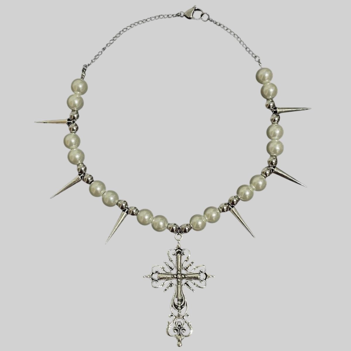 Collar de púas con dije de cruz