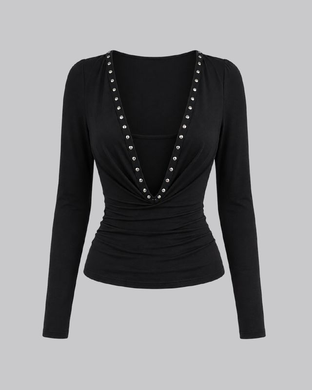 Blusa manga larga cuello caído con remaches