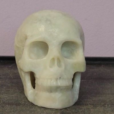 Quartz Tourmalinated Skull 5"x4" / 1242g by Skullis
