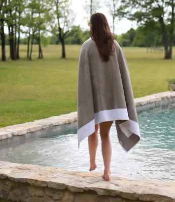 Head to the beach with these handsome, color-framed beach towels. These 500-gram velour towels reverse to terry.  100% Long staple cotton 500 gram weight Imported from Portugal