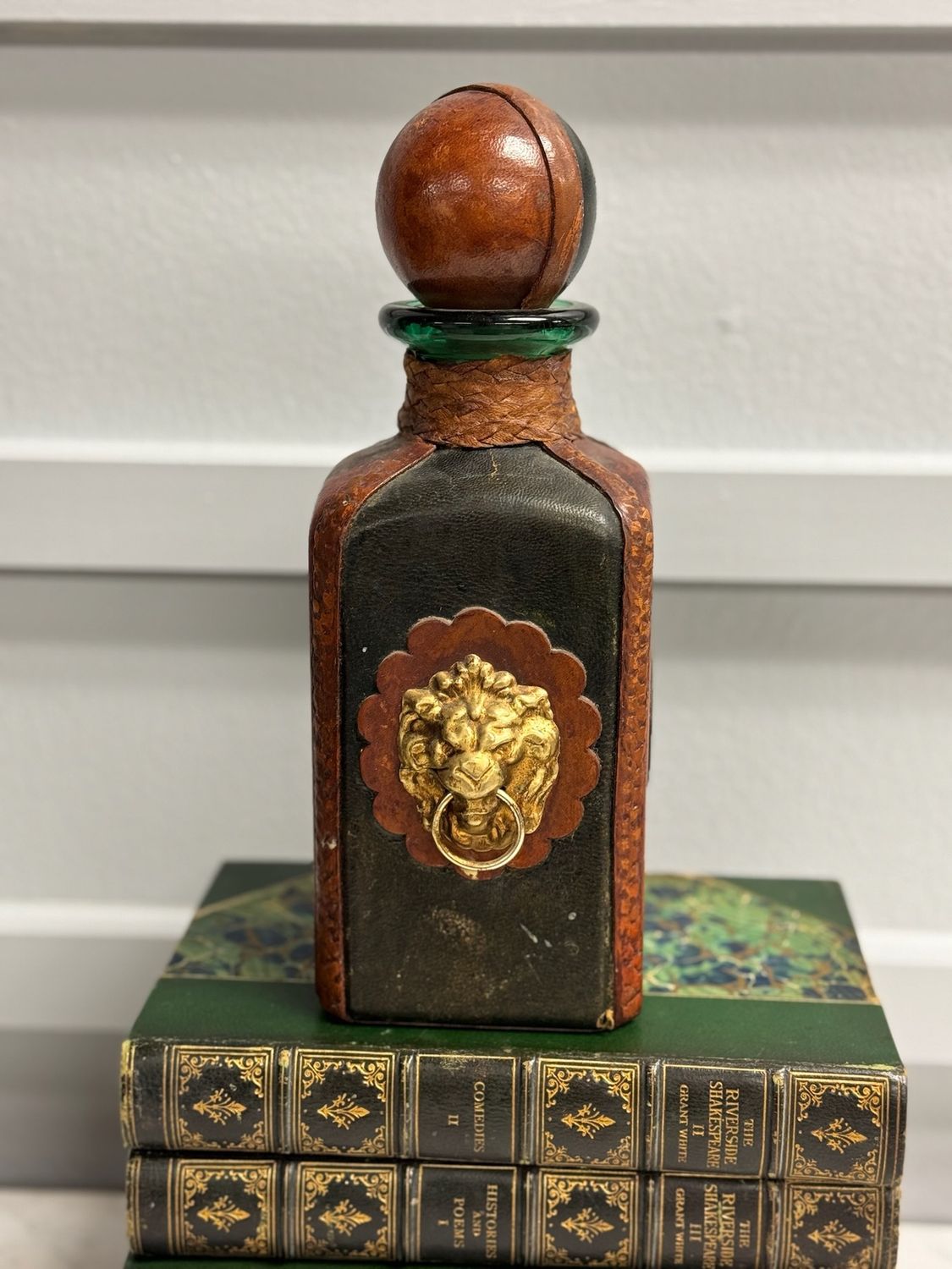 Lionhead decanter glass and leather