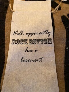 "Well apparently rock bottom has a basement" wine bag
