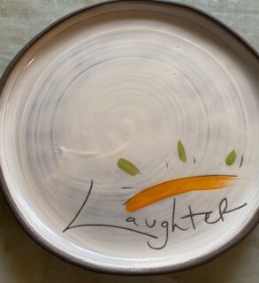 "Laughter" ceramic small round plate