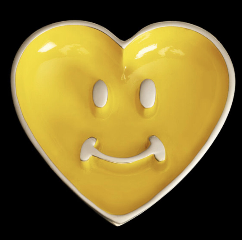Yellow smiley heart bowl with heart spoon.