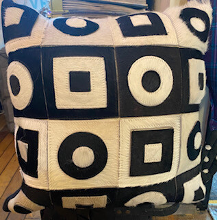 Leather and hide geometric pillow-one left