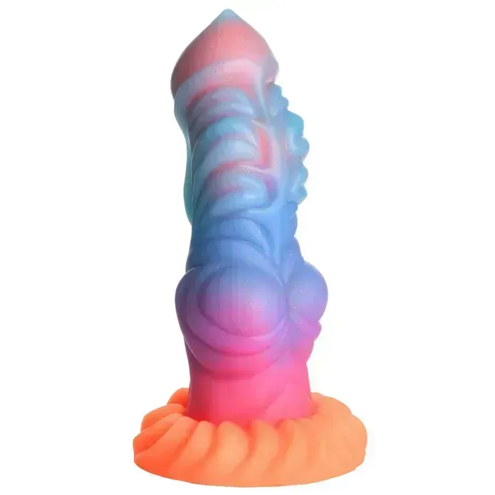 A silicone dildo modeled to look like an alien penis. Its pour features a pale pink core most visible at the tip, ranging from sky blue just below the head, to purple at the center, then hot pink nearer the base, finally ending in a bright orange base. It features a tapered tip, a prominent texture of smooth ridges and whorls, a slight knot towards the base, and a textured base to grind on. 