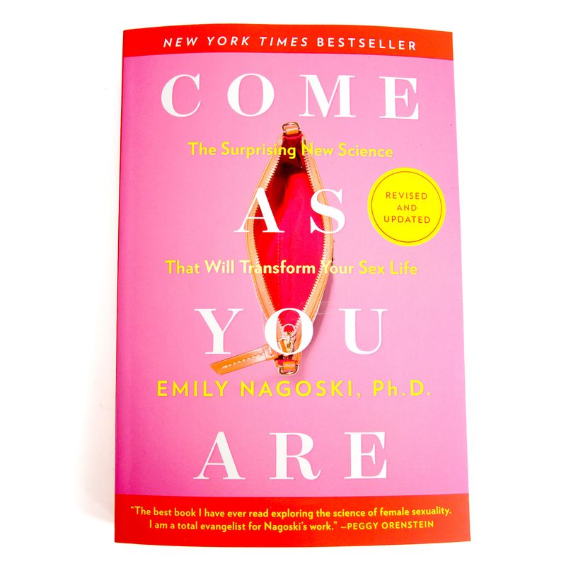 Come As You Are by Emily Nagoski - a pink cover with large white and yellow text, above a thoroughly yonic image of a zipper