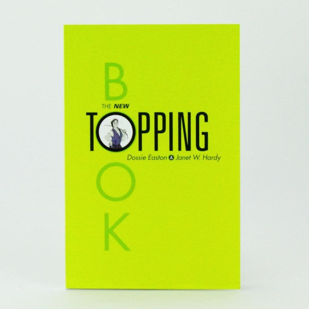A thin lime green volume with a picture of a smiling top with a cane over their shoulder and black + gray text