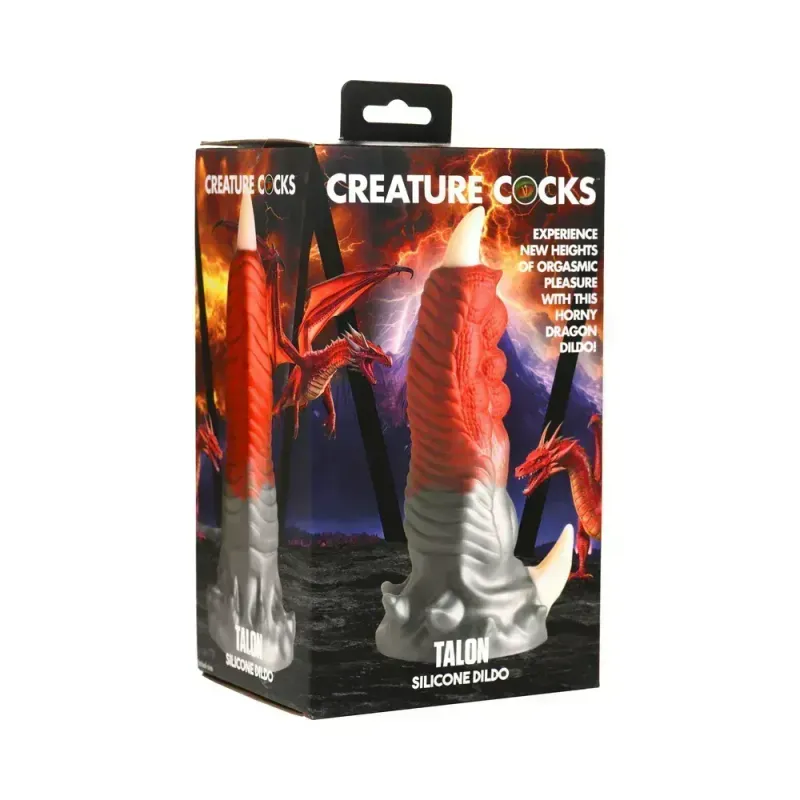 The Creature Cocks Talon silicone dildo in its box, depicted in front of an illustration of a red, classically styled dragon. The toy resembles a large taloned digit, shiny silver at the base and blending into a deep crimson at the top, tipped with a nubby off-white claw at the base and tip. 