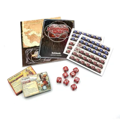 Summoner Wars Starter Set components with cards, dice, tokens, rulebook and battle mat.