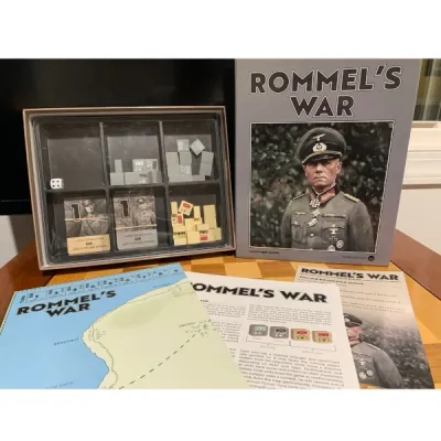 Rommel’s War components showing the box, mounted map, rules, cards, blocks, dice, and storage tray.