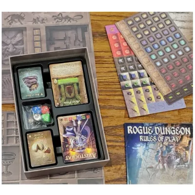 Rogue Dungeon Second Edition components with cards, dice, rules booklet, play mat, and token sheets.