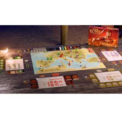 Total War: Rome – The Board Game set up with map board, faction boards, cards, tokens and game box.