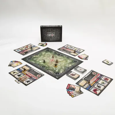 Ring of Chaos Platinum Edition game setup with board, player mats, cards, miniatures, and box.