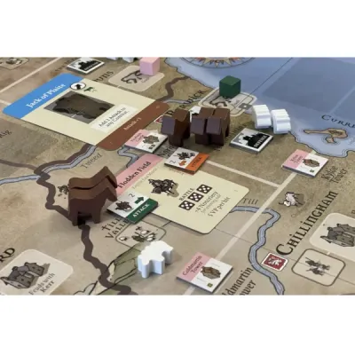 Border Reivers gameplay close-up with map board, cards, wooden sheep, horse meeples, and family pieces.